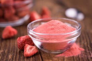 photo of Strawberry microdried fruit on wooden background