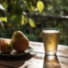 photo of pears on a plate in an orchard next to a pint of beer